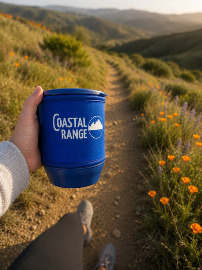 "Compact Coastal Range Backpacker stove held in one hand on a trail