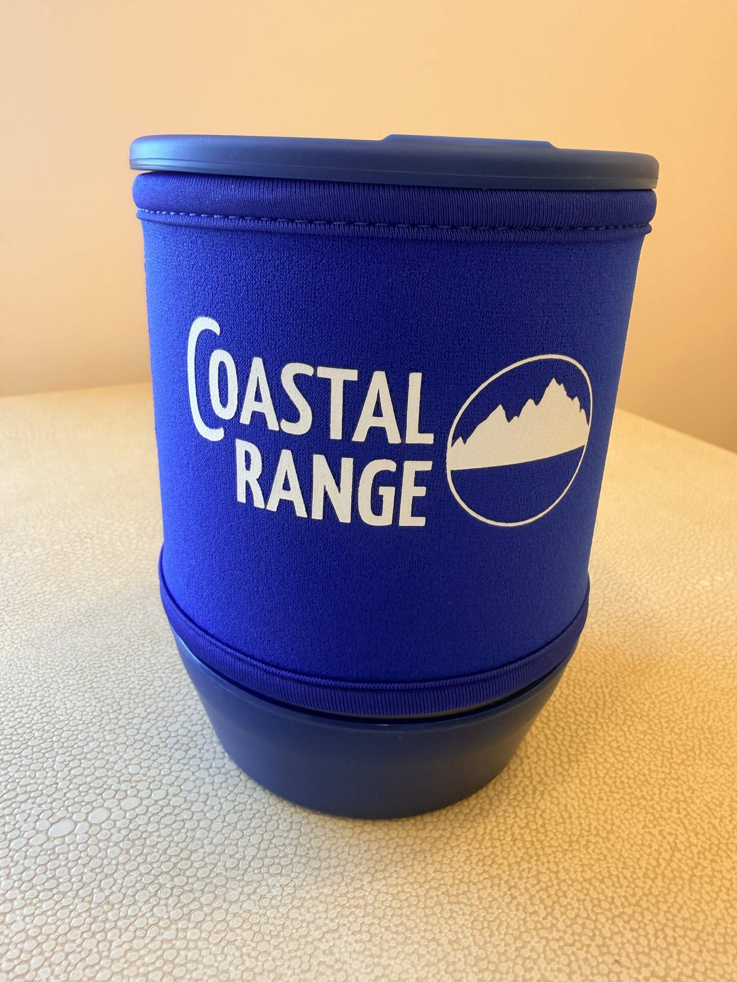 Closed Coastal Range Backpacker with the strainer lid on top and the bowl beside it.